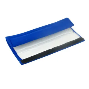 Close-up of soft blue plush car seatbelt cover detail showcasing comfortable fuzzy texture.