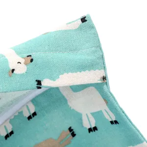 Baby diaper hanging storage bag detail, turquoise fabric with cute white alpaca print, zipper.