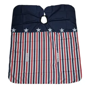 Detailed view of patriotic red white and blue star stripe hairdressing cape for professional salon use.