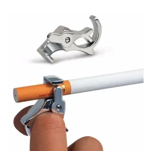 Detail view of metal cigarette holder ring showing finger wearing and grip mechanism clearly.