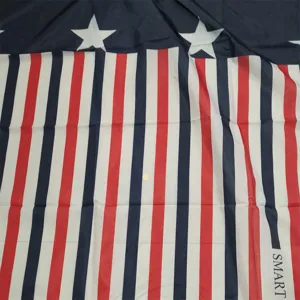 Red white and blue striped hairdressing cape with stars for professional salon and home use.