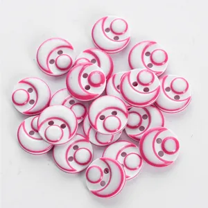 Colorful resin buttons with two holes, pink and white design, perfect for shirts and crafts.