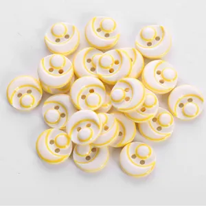 Close-up view of colorful resin buttons, two hole design with fine yellow pattern.