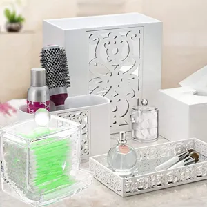 Acryl Wattestäbchenbehälter und weißer, geschnitzter Make-up-Schreibtisch-Organizer.