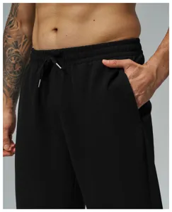 Pantaloni casual waffle uomo vista dettagliata, pantaloni neri con coulisse elastica, sport.