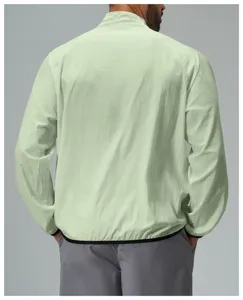 Back view of the light green lightweight windbreaker jacket, featuring a stand-up collar.
