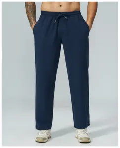 Dettaglio pantaloni casual in maglia waffle, comodo girovita con coulisse, tessuto traspirante.