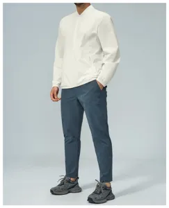 Men's casual stand-up collar zip jacket and slim trousers detail view showcasing fit.