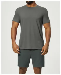 Close-up detail of dark gray short sleeve crew neck t-shirt and textured shorts for men.