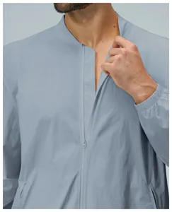 Detailed close-up view of the men's light blue stand collar zip-up jacket fabric and zipper.