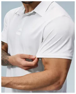 Close-up detail shot of the men's white short sleeve polo shirt, focusing on fabric texture.