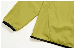 Men's lightweight outdoor sun protection jacket cuff and pocket detail view in green.