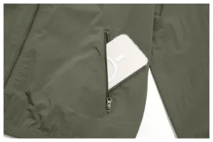 Men casual olive green jacket detail close-up showing zipper pocket and smooth fabric.