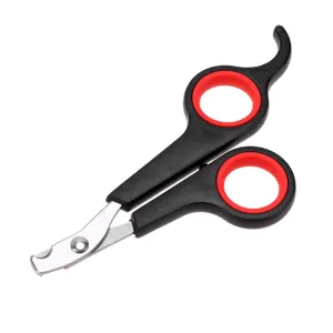 Pet nail clipper detail showing ergonomic black and red handle with sharp stainless steel blade.