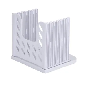 Adjustable plastic bread slicer detail view, showing multiple uniform toast cutting slots.