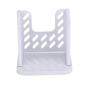 Adjustable white plastic bread slicer detail showing cutting slots for toast and cake slicing.