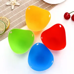 Close-up detail of colorful silicone egg poachers set, kitchen cooking tools for easy boiling.