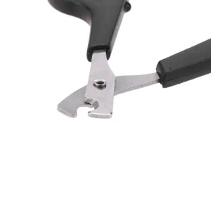 Close-up detail of stainless steel pet nail clipper with black handle for small animals.