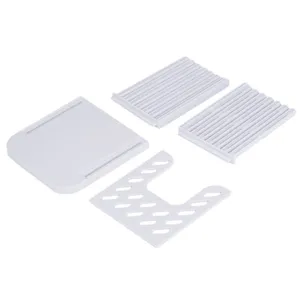 White plastic bread slicer detail view, showing disassembled components and guide slots.