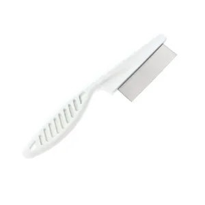 Detailed view of the pet flea comb with white plastic handle and fine metal teeth for grooming.