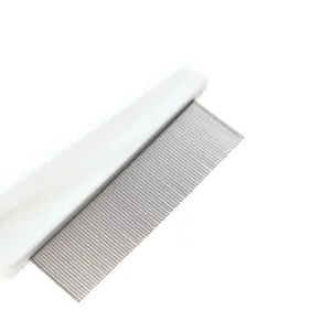 Close up of fine metal teeth on white plastic handle pet flea comb for daily grooming.