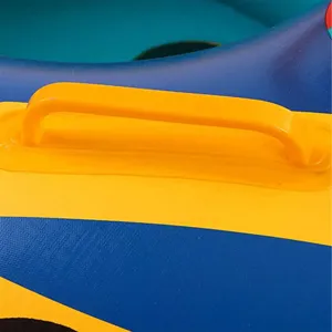 Close up view of yellow safety handle on blue and yellow inflatable pool float for kids water fun.