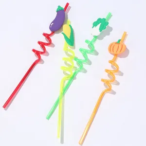 Close-up of creative vegetable shaped curly straws with cute eggplant corn and pumpkin designs.