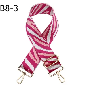 Pink white zebra print replacement bag strap with adjustable length and gold hardware.