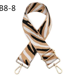 Replacement zebra pattern bag strap, adjustable crossbody canvas strap with gold hardware details.