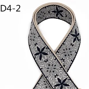 Ethnic jacquard webbing detail, 5cm width grey cotton-polyester ribbon with floral pattern.