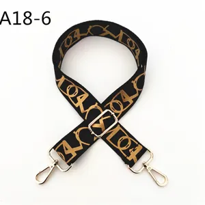 Correa de hombro de repuesto tejida en negro y dorado con hebillas metálicas ajustables para bolsos.