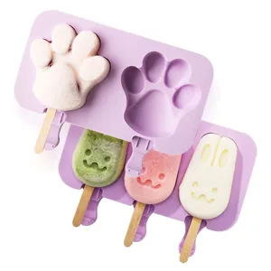 Silicone popsicle mold detail showing cute cat paw and rabbit shapes with wooden sticks.