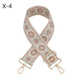Wide woven embroidered bag strap replacement ethnic style adjustable shoulder strap with gold hardware.
