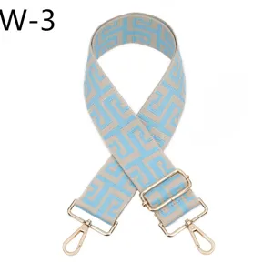 Adjustable jacquard replacement bag strap with gold metal hardware for crossbody bags.