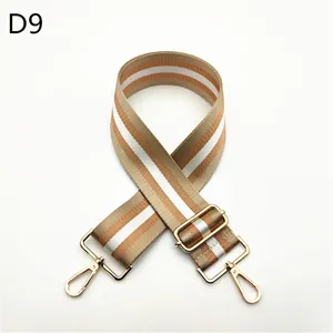 Replacement adjustable bag strap with striped webbing and gold tone hardware for crossbody bags.