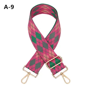 Wide embroidered bag strap with colorful argyle pattern and gold metal hardware for purses.