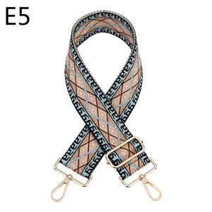 Ethnic style geometric woven replacement bag strap detail, adjustable gold metal hardware.