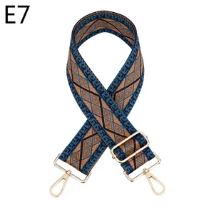 Ethnic style woven replacement bag strap with golden hardware and adjustable buckle.