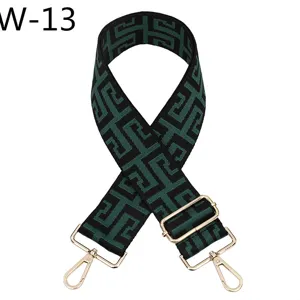 Replacement bag strap with geometric jacquard pattern and gold tone metal hardware, adjustable.