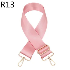 Roze vervangende tasband met gouden verstelbare metalen hardware voor schoudertassen.