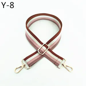Adjustable replacement bag strap with brown white pink stripes and gold hardware accessories.