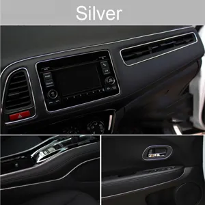 Car interior decorative trim strip detail, flexible gap molding line for dashboard and door panel.