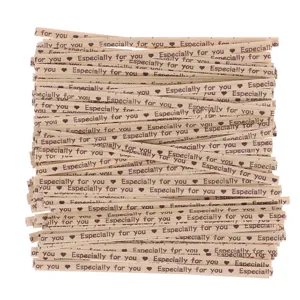 Brown kraft paper twist ties for bakery packaging and candy bag sealing detail.