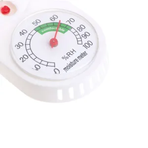Detailed close-up of a white analog hygrometer dial showing clear humidity scale and comfort zone.