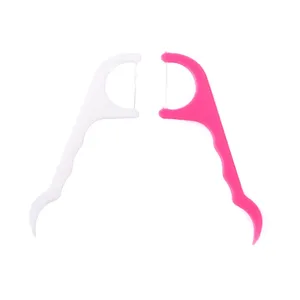 Dual-end plastic dental floss picks in white and pink, featuring durable thread and fine pick.