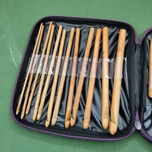 Carbonized bamboo crochet hooks set with zippered storage bag, durable DIY weaving tools.