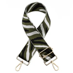 Replacement bag strap with chic zebra pattern design and gold tone metal hardware for women.