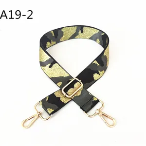 Detailed view of replacement camo bag strap with gold-tone metal hardware and adjustable buckle.