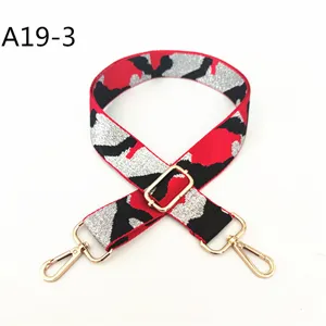 Replacement camouflage jacquard bag strap with gold metal hardware, adjustable length.