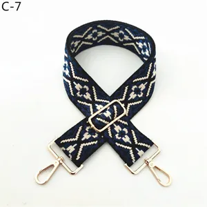Replacement woven bag strap with blue ethnic pattern and adjustable golden hardware parts.